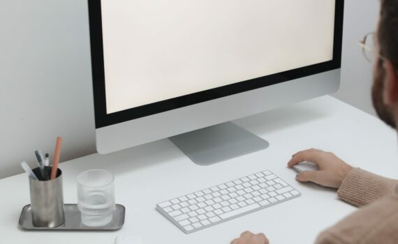 Free Crop man working on computer in workplace Stock Photo