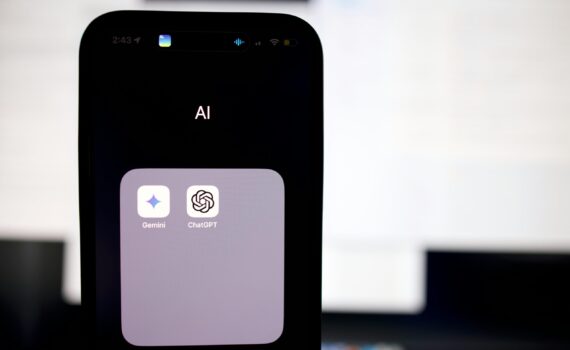 a close up of a cell phone with an ai button