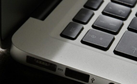 Free Detailed view of a silver laptop showing keyboard and multiple ports. Stock Photo